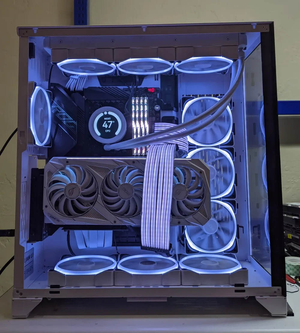 White custom PC with sleeved cables, liquid cooling and illuminated fans